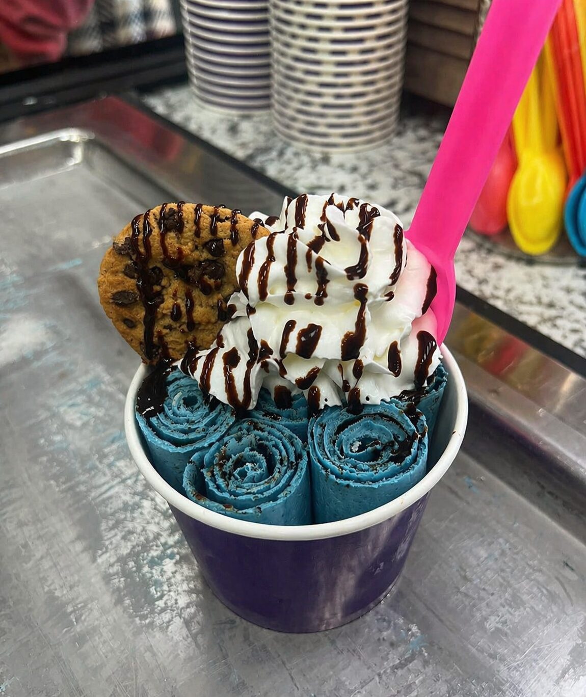 Ice cream being rolled on a freezing plate